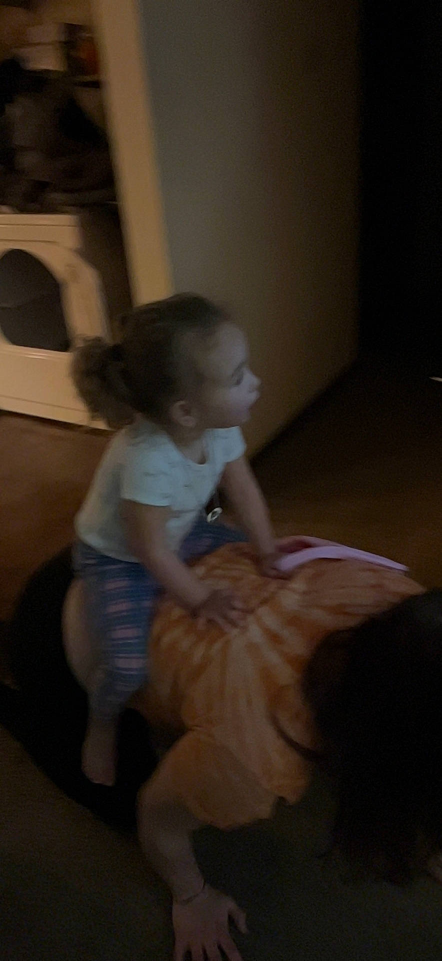 Caroline is registered to the contest to win money with this photo: baby, child, comfort, floor, flooring, fun, hardwood, human_leg, knee, person, play, room, sitting, t_shirt, toddler, wood, wood_flooring