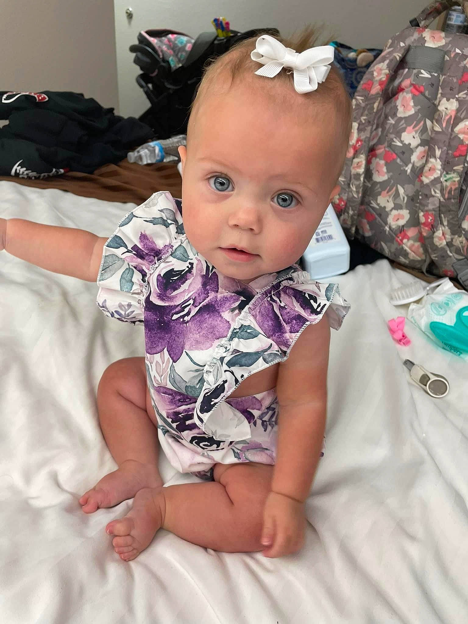 Haven is registered to the contest to win money with this photo: arm, baby, baby_toddler_clothing, cheek, child, comfort, eyelash, fashion_accessory, happy, iris, magenta, neck, pattern, person, pink, purple, sitting, skin, sleeve, thigh