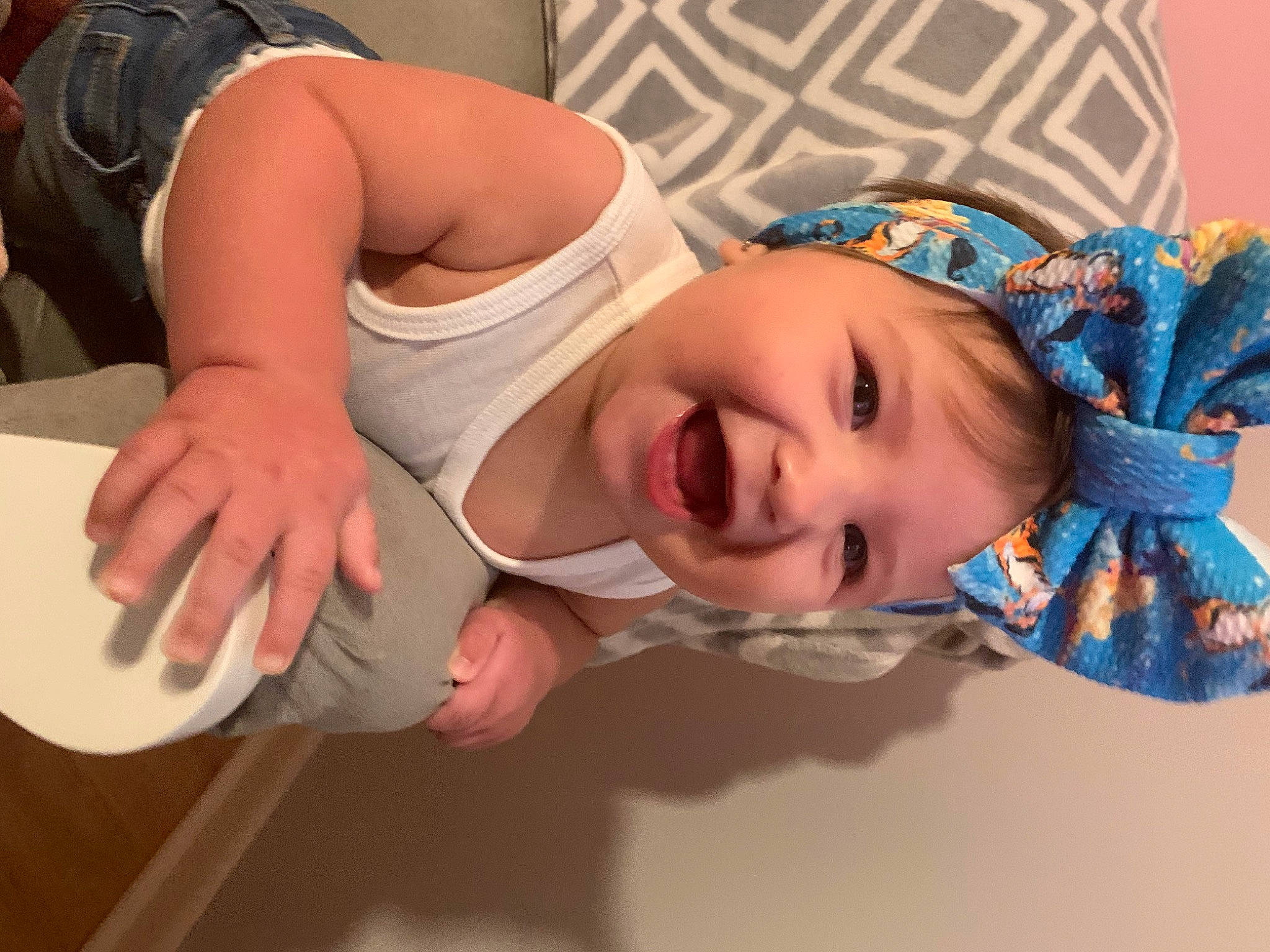 Arwen is registered to the contest to win money with this photo: baby, baby_products, baby_toddler_clothing, cheek, chest, child, elbow, eye, facial_expression, fashion_accessory, finger, fun, happy, headwear, luggage_and_bags, mouth, neck, pattern, person, skin