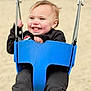Rivhur is registered to the contest to win money with this photo: toddler, child, swing, playground, blue_swing, smiling, happy, outdoor, sand, clothing, black_pants, black_sweater, face, hands, hair, person, fun, play, joy, park