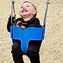 toddler, child, swing, playground, laughing, joyful, blue_swing, black_clothing, shoes, outdoor, sand, happy, baby, person, fun, chains, seat, smile, cute, motion