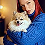 affection, blue_sweater, close_up, companion, cozy, cute, dog, friendly, furry, happy, hugging, indoor, long_hair, pet, pomeranian, portrait, red_hair, smiling_dog, warm_lighting, woman