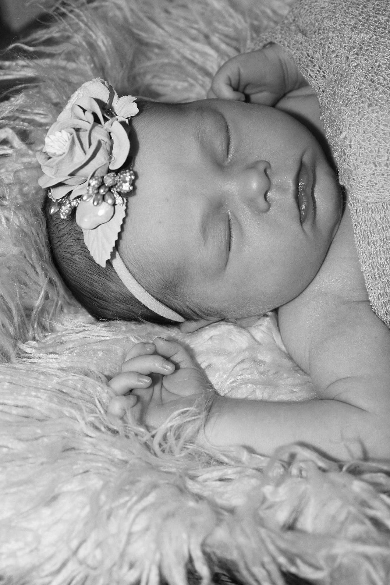 Eliza is registered to the contest to win money with this photo: arm, baby, bedtime, child, comfort, eye, eyebrow, flash_photography, fur, grass, hand, happy, headgear, interaction, iris, linens, monochrome, monochrome_photography, person, skin