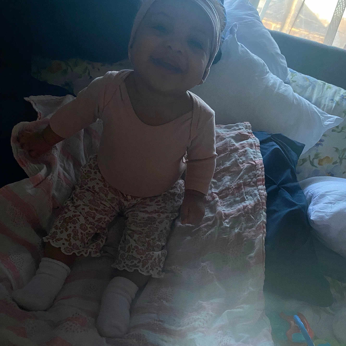 Ziy is registered to the contest to win money with this photo: baby, bed, bedroom, clothing, couch, cushion, face, furniture, hat, head, homedecor, hosiery, indoors, linen, person, photography, portrait, quilt, room, sock