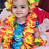 Scarlet Cristen is registered to the contest to win money with this photo: accessories, baby, clothing, costume, dress, face, flower, flowerarrangement, flowerbouquet, happy, hat, head, lei, ornament, person, petal, photography, plant, portrait, smile