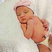Sawyer is registered to the contest to win money with this photo: baby, blanket, bow, child, cozy, cute, diaper, headband, human, infant, lying_down, newborn, peaceful, pink, resting, skin, sleepy, small, soft_texture, white