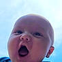 baby, child, face, closeup, expression, mouth_open, sky, blue_sky, outdoor, cute, joyful, surprised, infant, person, clothing, toddler, head, cheeks, animal_patch, casual