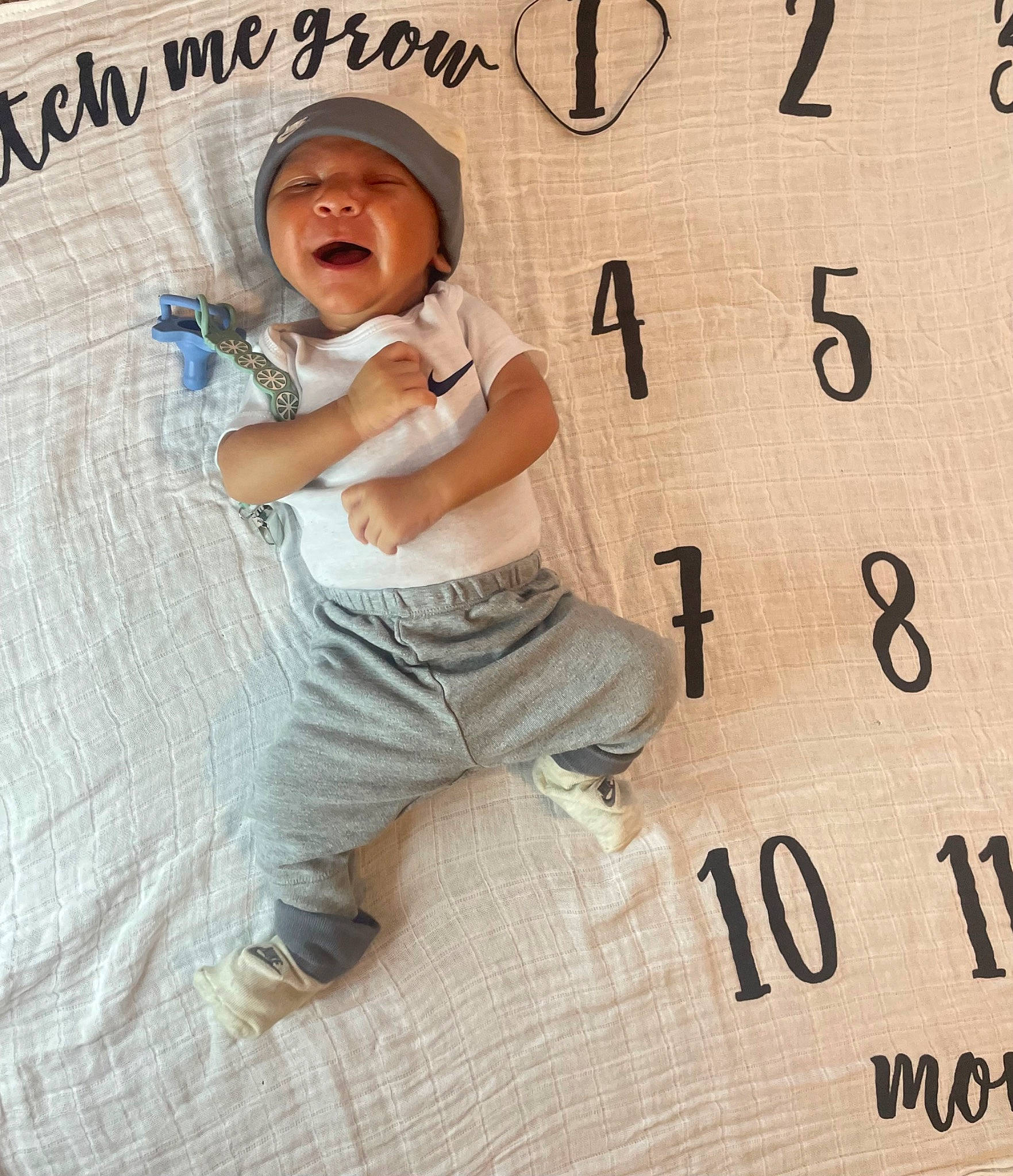 Zane joined the competition — help win amazing prizes! baby_toddler_clothing, baseball_cap, cap, child, circle, elbow, eyewear, flooring, font, happy, hat, headwear, number, pattern, person, sitting, sleeve, sun_hat, symbol, t_shirt