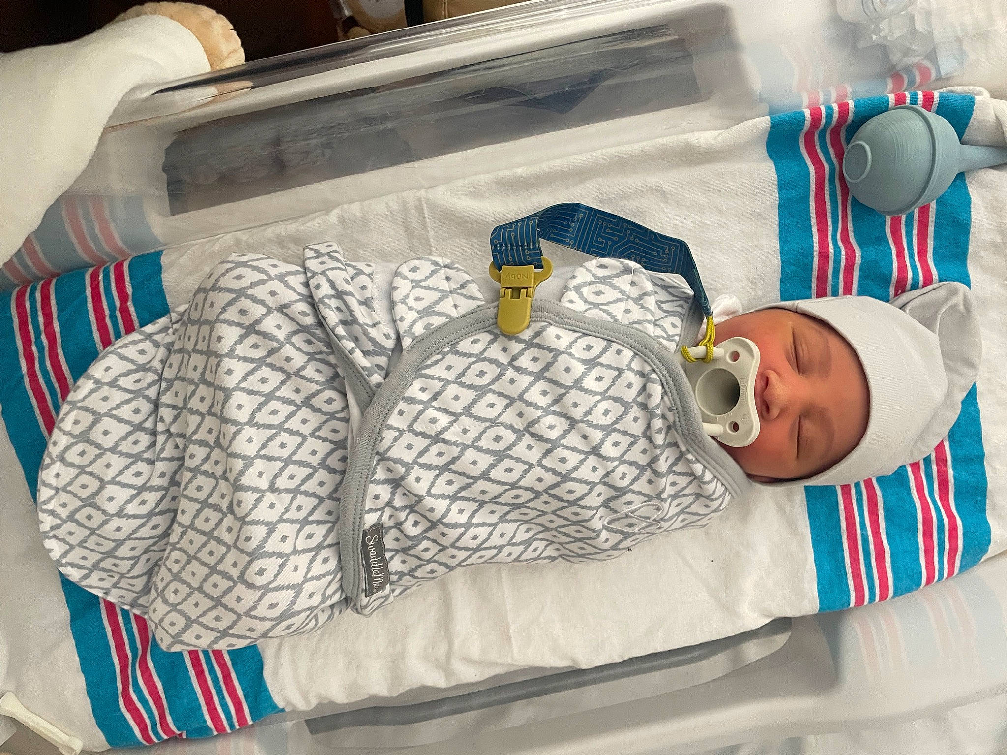Zane is registered to the contest to win money with this photo: baby, baby_products, baby_sleeping, bedding, child, comfort, couch, electric_blue, headgear, headwear, health_care, hospital, hospital_bed, linens, medical, medical_equipment, person, product, room, textile