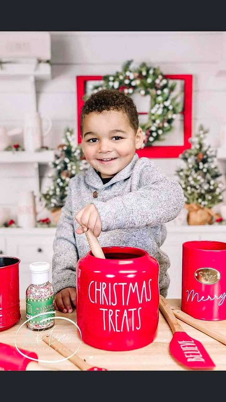 Graysen joined the competition — help win amazing prizes! christmas, christmas_decoration, christmas_eve, christmas_ornament, coffee_cup, cup, drink, drinkware, event, happy, holiday, joy, mug, person, red, serveware, sitting, sleeve, smile, sweetness