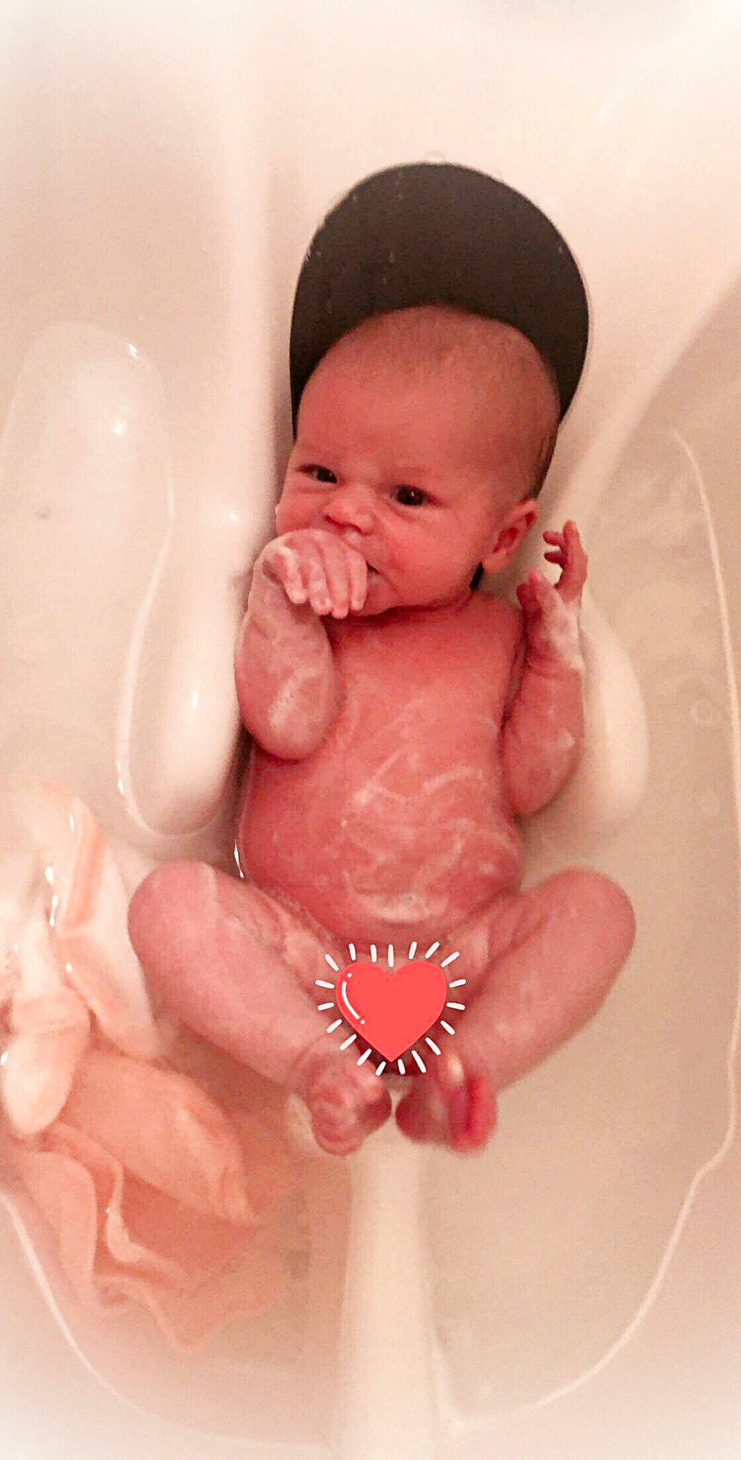 Baileigh is registered to the contest to win money with this photo: baby, baby_bathing, bathing, bathtub, birth, cheek, child, face, hand, head, lip, mouth, nose, person, pink, skin, stomach, toddler, washing