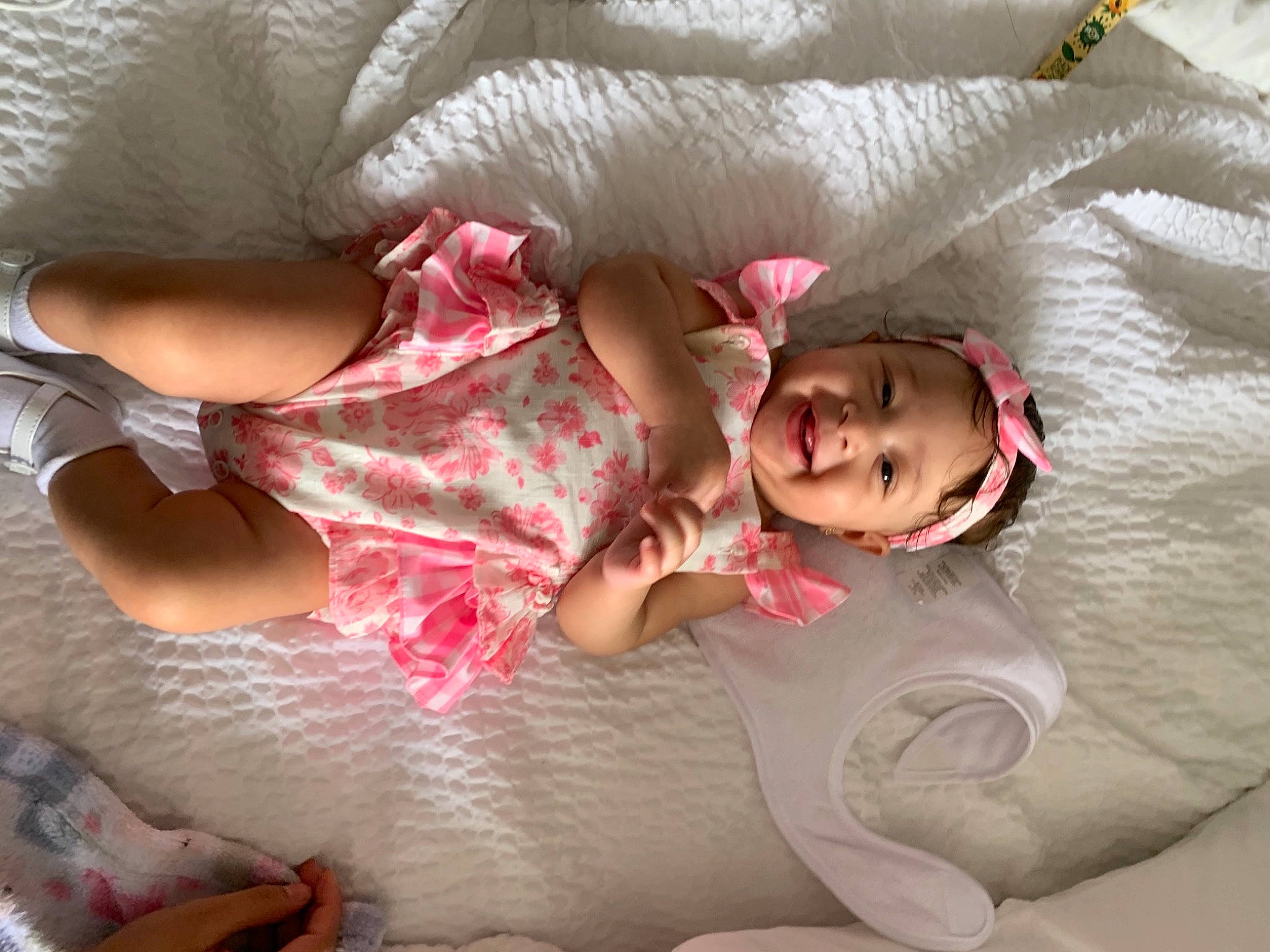 Avriana is registered to the contest to win money with this photo: abdomen, baby, baby_toddler_clothing, bed, child, comfort, eye, finger, happy, head, headwear, human_body, joy, leg, linens, mouth, people, person, pink, skin