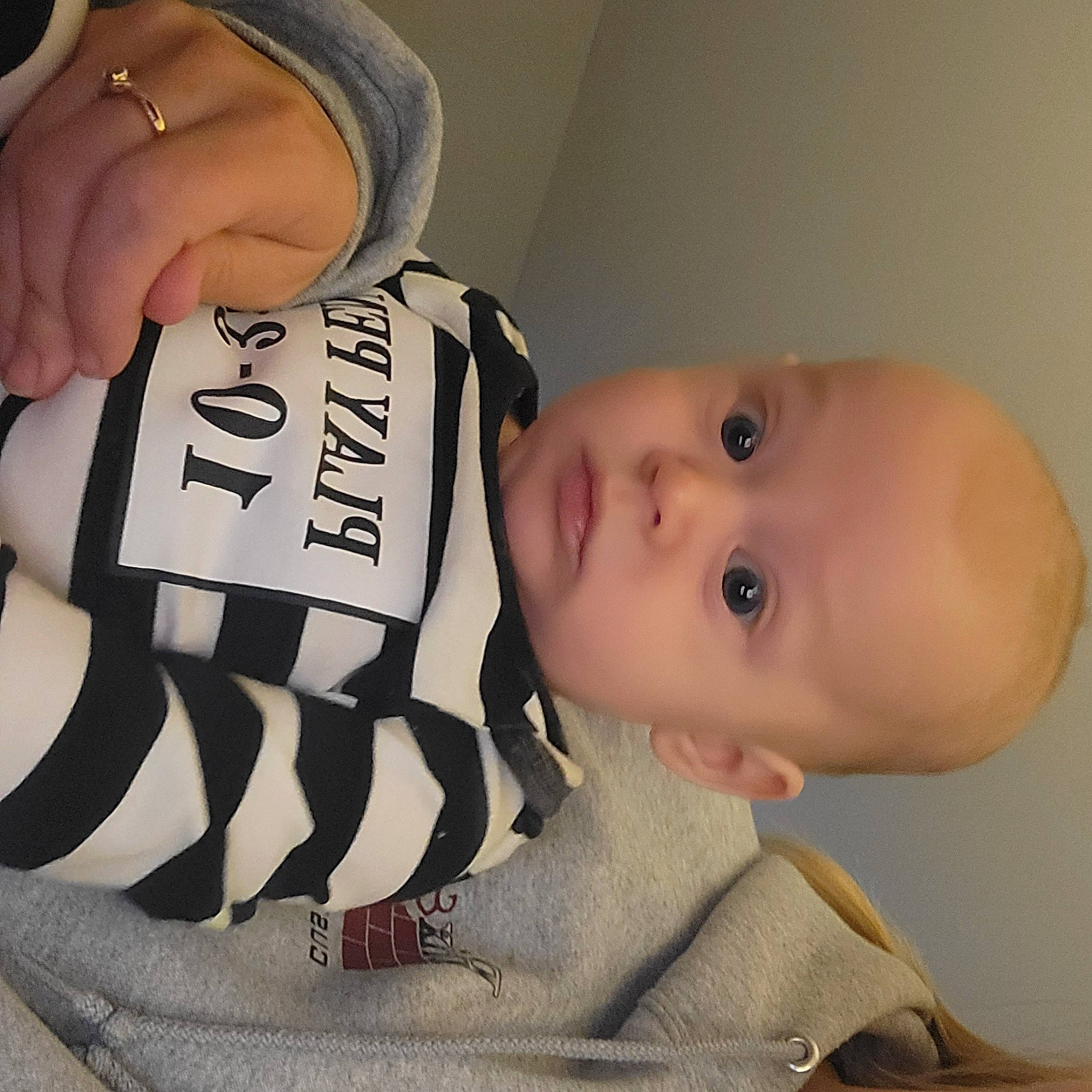 Jensen is registered to the contest to win money with this photo: baby, baby_toddler_clothing, cap, cheek, child, chin, eye, eyebrow, eyelash, face, finger, hairstyle, head, lip, mouth, neck, nose, person, skin, sleeve