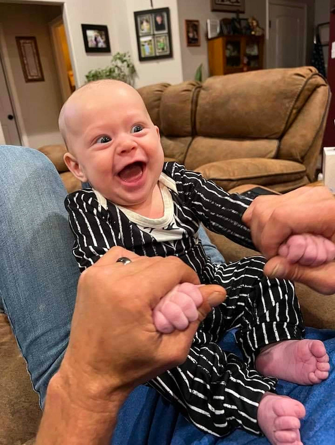 Jensen joined the competition — help win amazing prizes! baby, chair, child, comfort, couch, door, event, finger, gesture, hand, happy, lamp, nail, person, picture_frame, room, sitting, smile, thumb, toddler