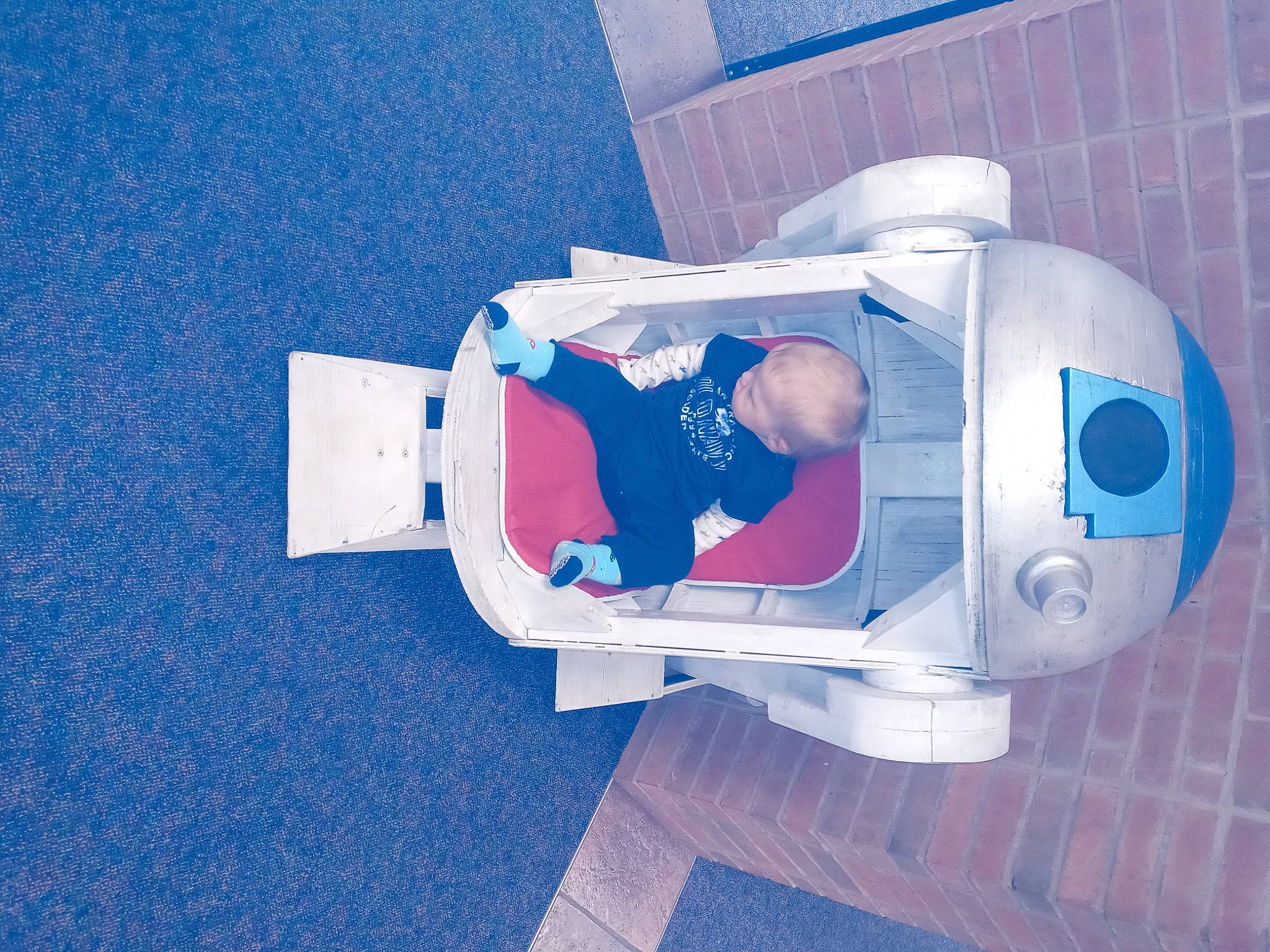 Joesph is registered to the contest to win money with this photo: automotive_design, blue, carmine, electric_blue, fictional_character, flooring, font, gas, machine, person, personal_protective_equipment, plastic, sleeve, space