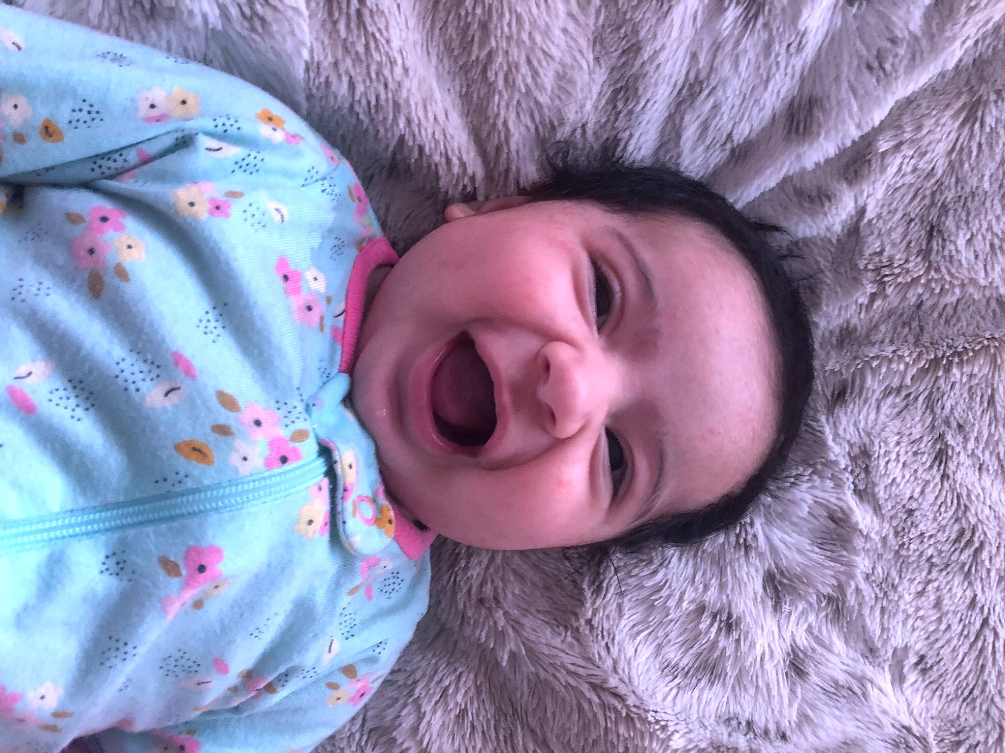 Malayah is registered to the contest to win money with this photo: baby_toddler_clothing, cheek, comfort, eye, flash_photography, grass, happy, iris, lip, mouth, nose, outerwear, person, pink, purple, skin, sleeve, smile, textile, toddler