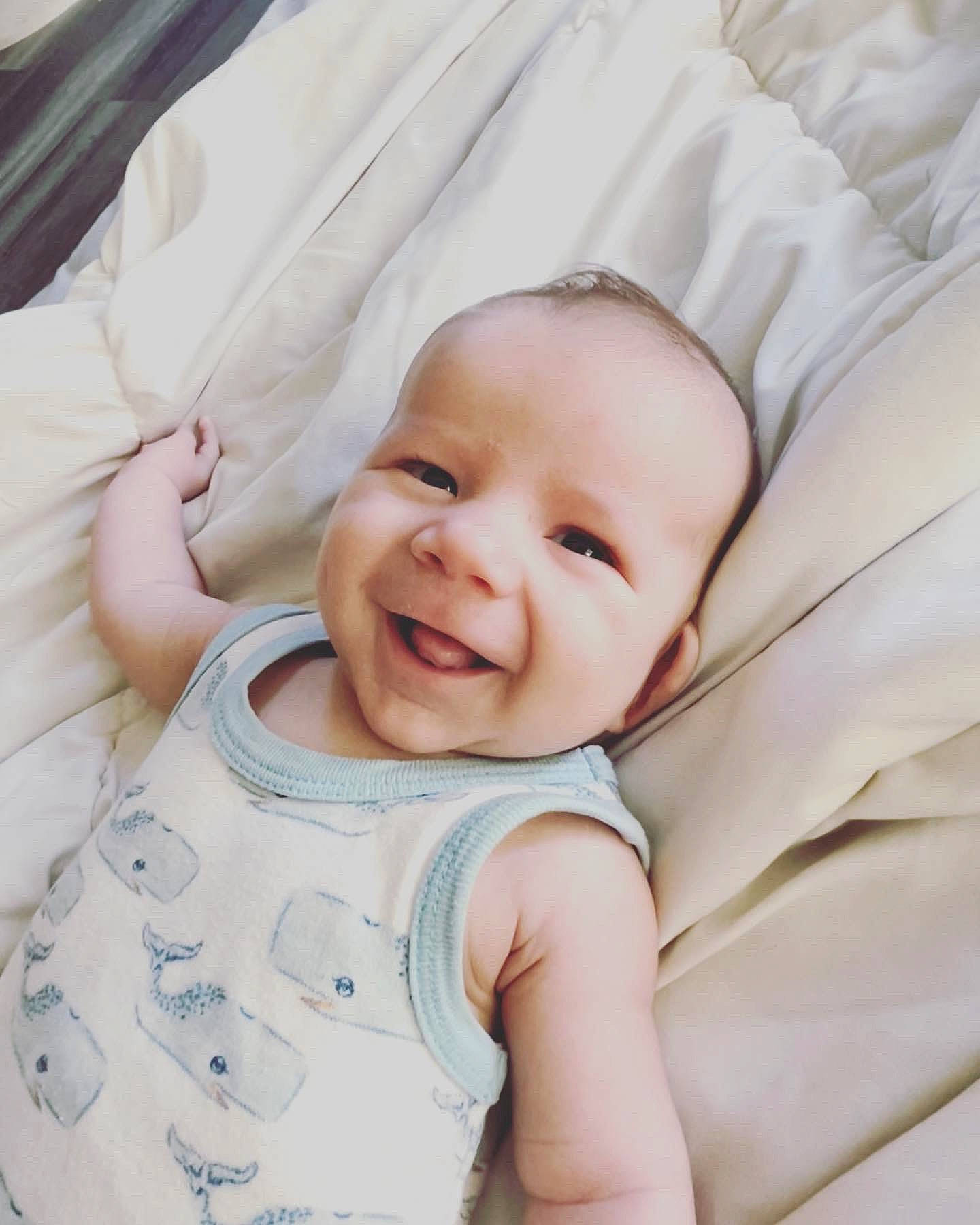 Samuel is registered to the contest to win money with this photo: baby, baby_toddler_clothing, cheek, child, chin, collar, comfort, eye, eyelash, face, happy, head, iris, linens, pattern, person, skin, sleeve, smile, textile