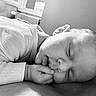 Chiara participe au concours pour gagner de l'argent avec cette photo : baby, sleeping, black_and_white, infant, hand, face, peaceful, soft_light, window, indoors, portrait, close_up, resting, cute, child, newborn, calm, texture, skin, cozy