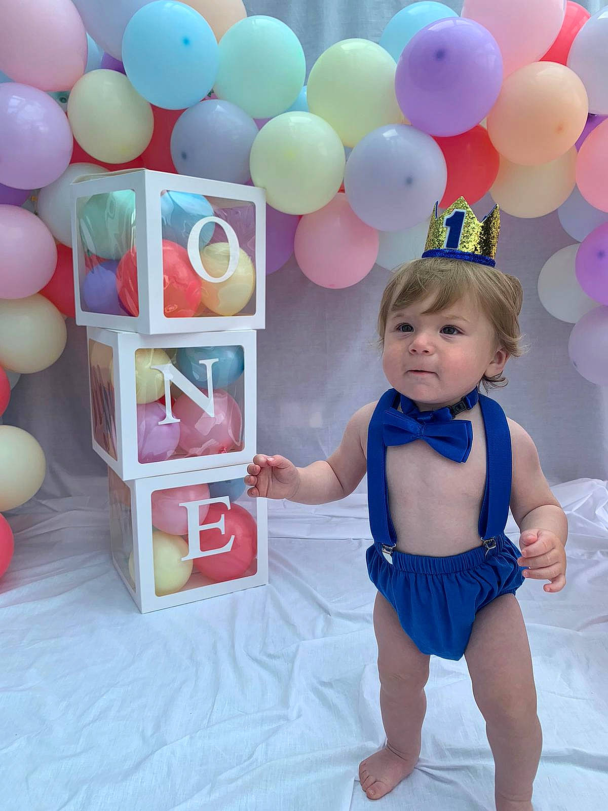 Bobby is registered to the contest to win money with this photo: baby, baby_playing_with_toys, baby_products, baby_toddler_clothing, balloon, child, electric_blue, event, font, fun, happy, leisure, magenta, party_supply, person, pink, play, sweetness, t_shirt, toddler