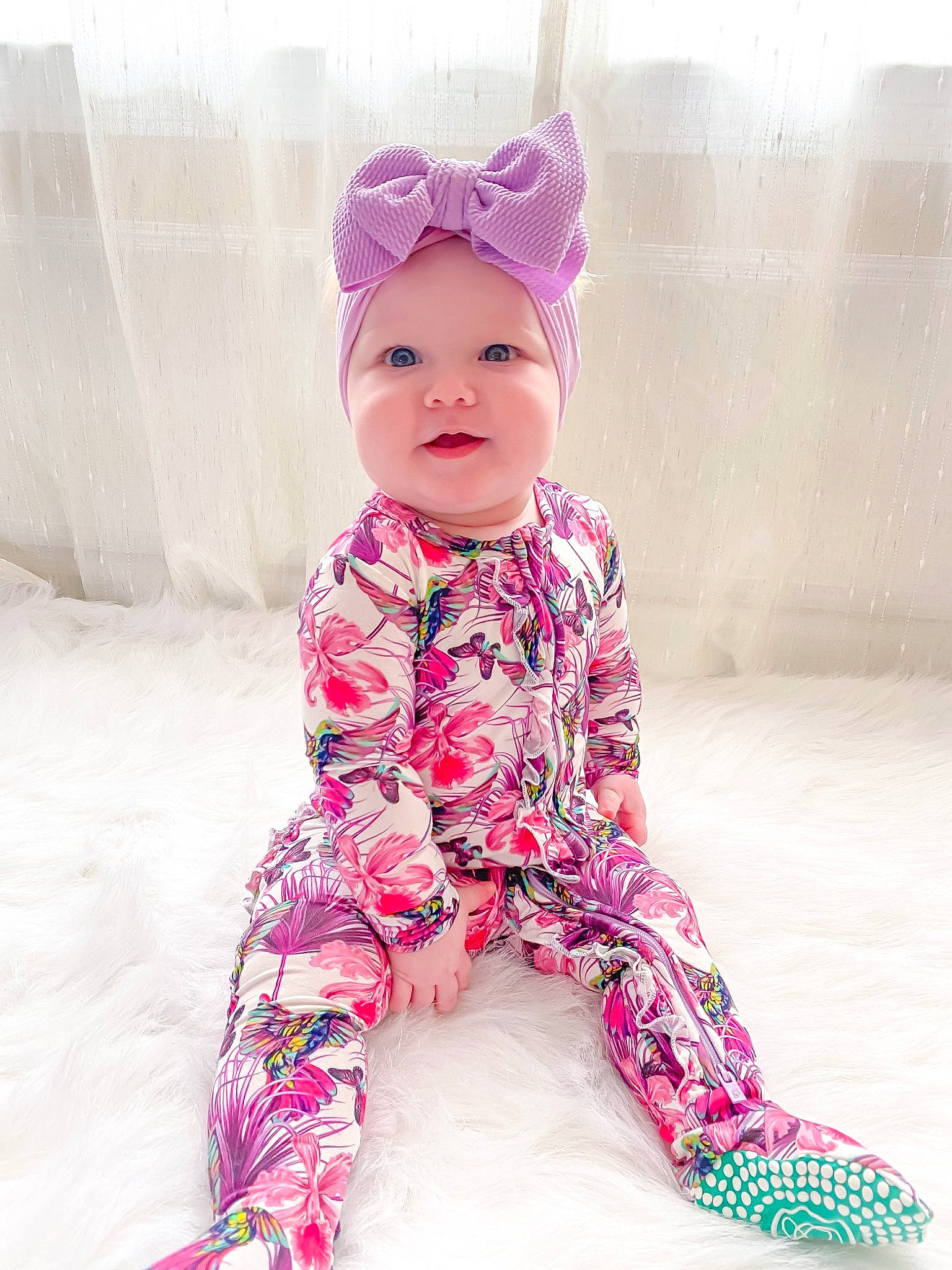 Margot joined the competition — help win amazing prizes! arm, baby, baby_toddler_clothing, face, fashion_accessory, fun, happy, head, headwear, human_body, magenta, pattern, person, personal_protective_equipment, pink, purple, sitting, skin, sleeve, smile