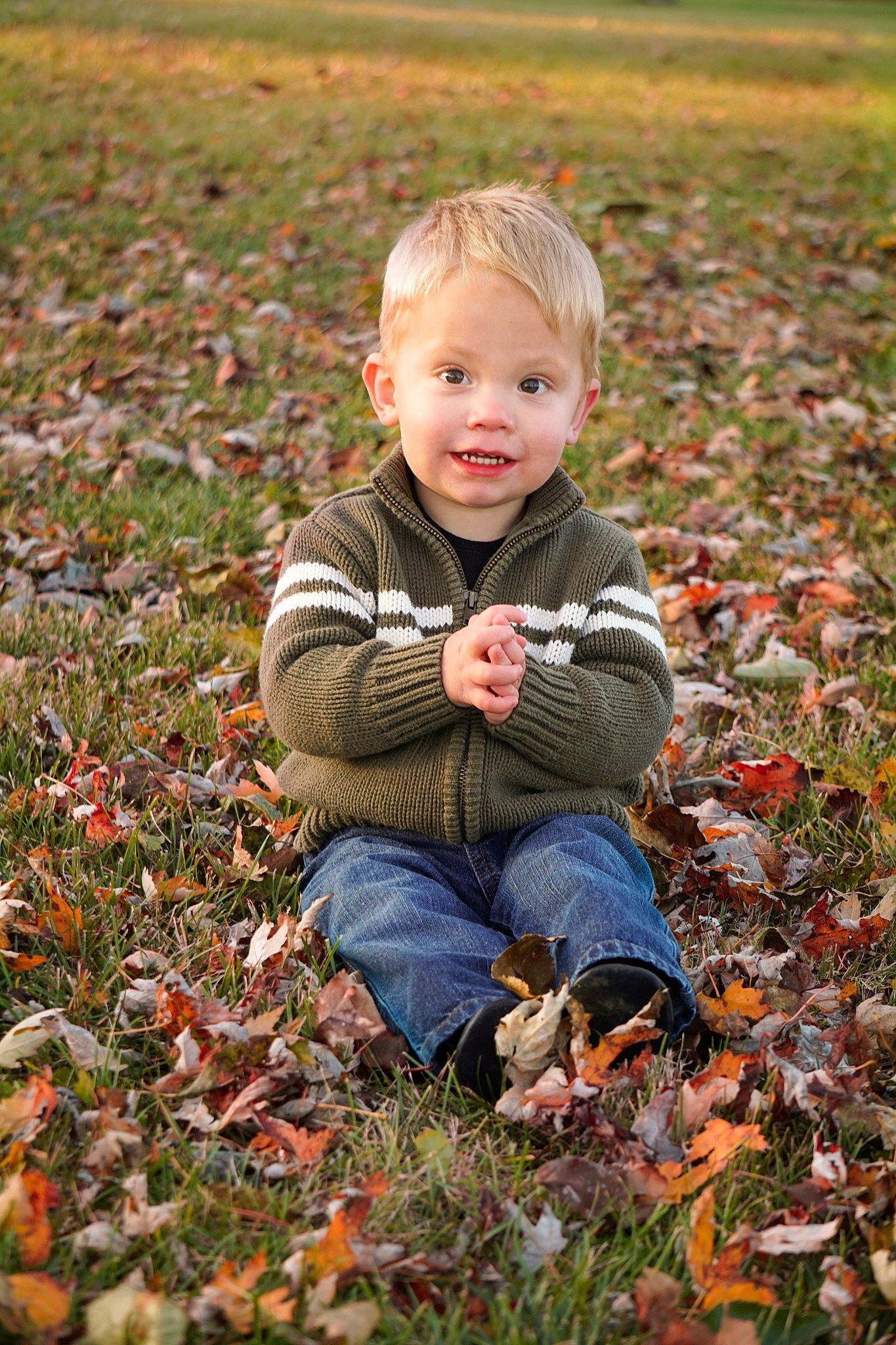 Easton joined the competition — help win amazing prizes! baby, baby_toddler_clothing, child, deciduous, field, grass, grassland, happy, landscape, leaf, natural_landscape, people_in_nature, person, plant, pumpkin, sitting, smile, soil, standing, toddler