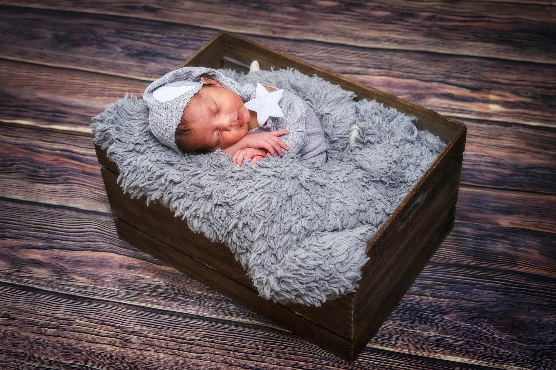 Liam joined the competition — help win amazing prizes! newborn, baby, sleeping, crate, wooden, blanket, hat, star, cozy, soft, infant, cute, resting, floor, texture, adorable, peaceful, portrait, indoor, child