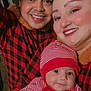 Liam is registered to the contest to win money with this photo: adult, baby, child, closeup, cozy, cute, face, family, happy, indoor, parent, people, portrait, red_clothing, smile, striped_hat, striped_outfit, tile_floor, togetherness, warm_clothing