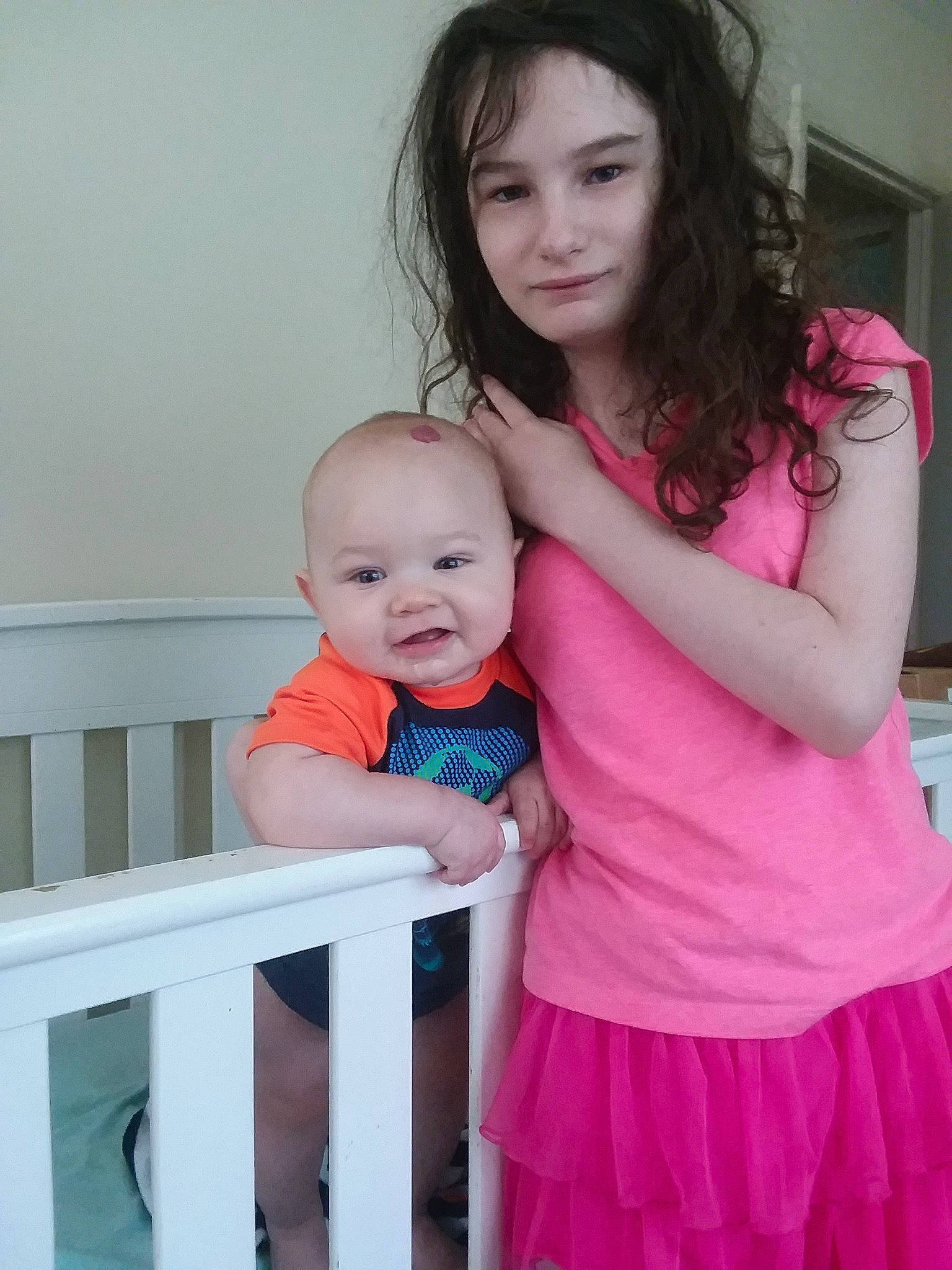 Marshall is registered to the contest to win money with this photo: baby, baby_products, baby_toddler_clothing, child, daughter, dress, furniture, magenta, mother, person, pink, product, sibling, sitting, skin, smile, standing, toddler