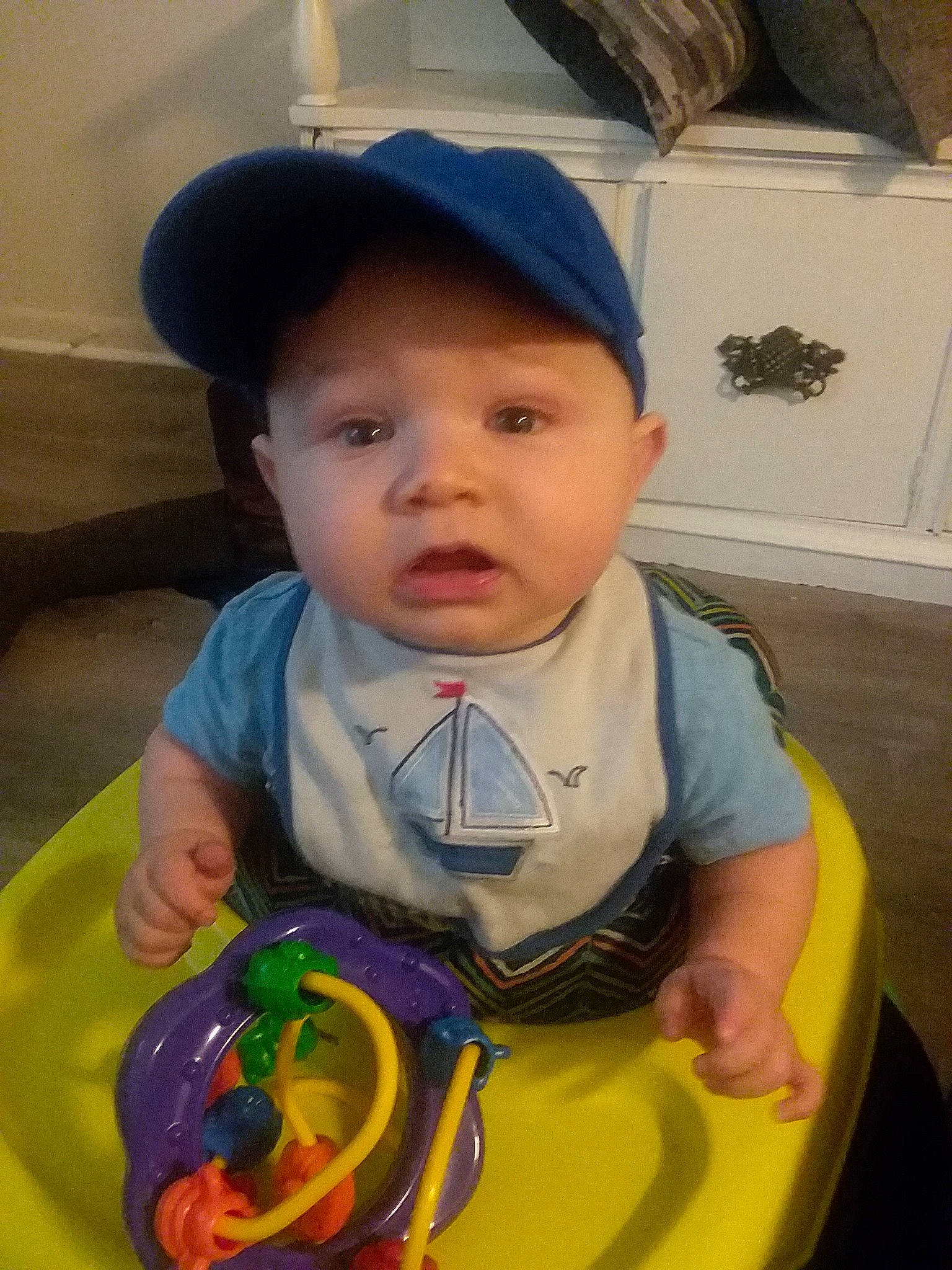 Marshall is registered to the contest to win money with this photo: baby, child, hat, headgear, person, play, smile, toddler