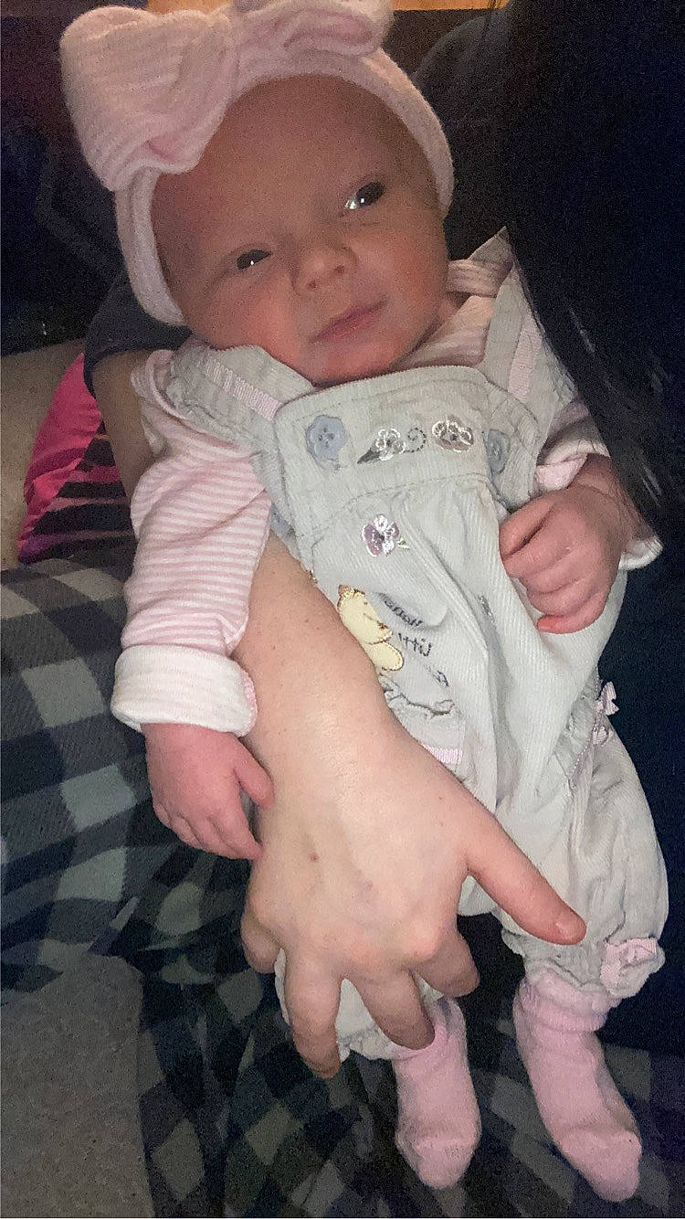 Esme is registered to the contest to win money with this photo: baby, baby_toddler_clothing, cheek, comfort, eye, eyebrow, finger, gesture, hand, head, iris, lip, mouth, nose, organ, person, pink, skin, sleeve, smile