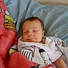 baby, sleeping, blanket, pillow, infant, cute, indoors, child, peaceful, clothing, bed, resting, cartoon, soft, comfort, person, toddler, cute_baby, nap, cozy