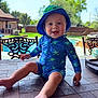 Kohen joined the competition — help win amazing prizes! baby, child, smiling, swimsuit, hat, blue, starfish, outdoor, pool, table, tile, sunny, backyard, chair, greenery, happy, sitting, person, summer, playful
