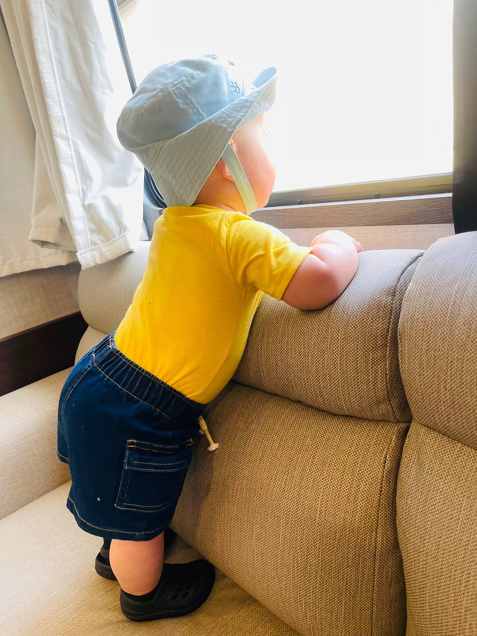 Jaxson joined the competition — help win amazing prizes! baby, baseball_cap, cap, child, elbow, electric_blue, hat, human_leg, knee, leg, person, plant, shorts, sneakers, standing, steering_wheel, t_shirt, thigh, toddler, vehicle_door