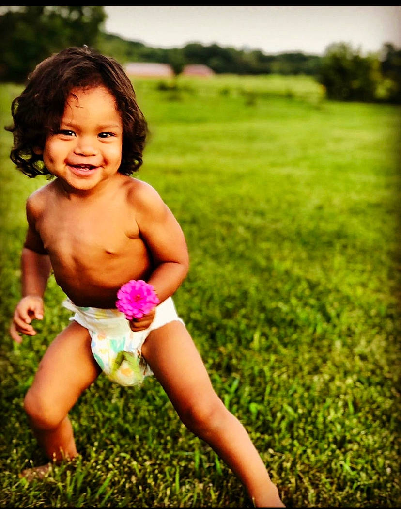 Zaidyn is registered to the contest to win money with this photo: abdomen, active_tank, baby, baby_toddler_clothing, child, child_model, field, finger, foot, grassland, happy, joy, meadow, pasture, people_in_nature, person, prairie, stomach, summer, thigh