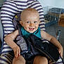 baby, child, smiling, seat, striped, bib, indoor, person, happy, furniture, home, floor, cage, toy, clothing, head, face, arm, leg, comfort