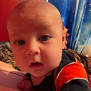 Roman joined the competition — help win amazing prizes! baby, child, face, eyes, hand, indoor, person, portrait, curious, clothing, striped, blanket, wall, bed, head, skin, young, expression, cozy, room