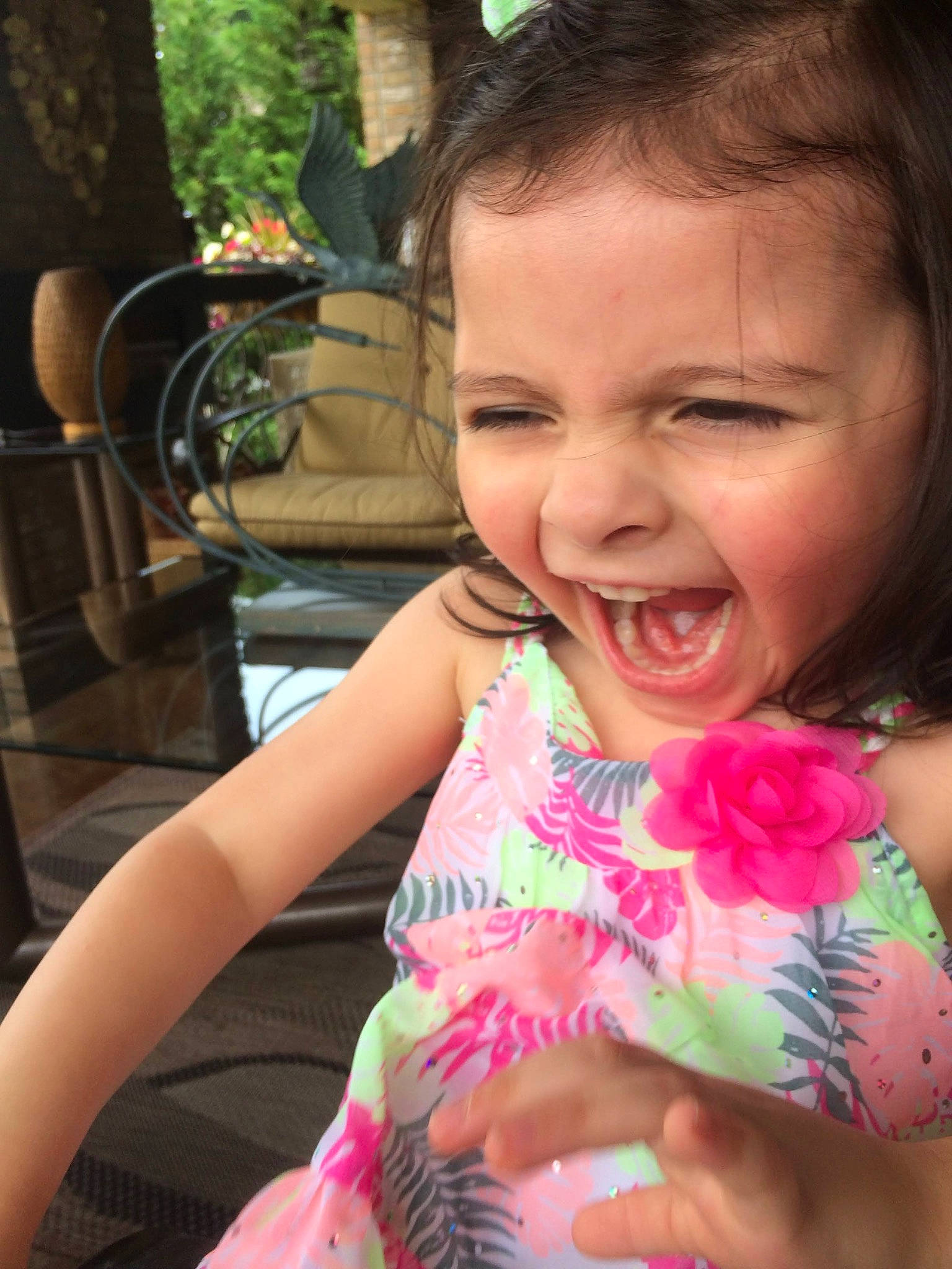 Sofia is registered to the contest to win money with this photo: cheek, child, cool, eye, finger, hairstyle, hand, happy, head, iris, leisure, lip, mouth, nose, person, pink, plant, skin, smile, thumb