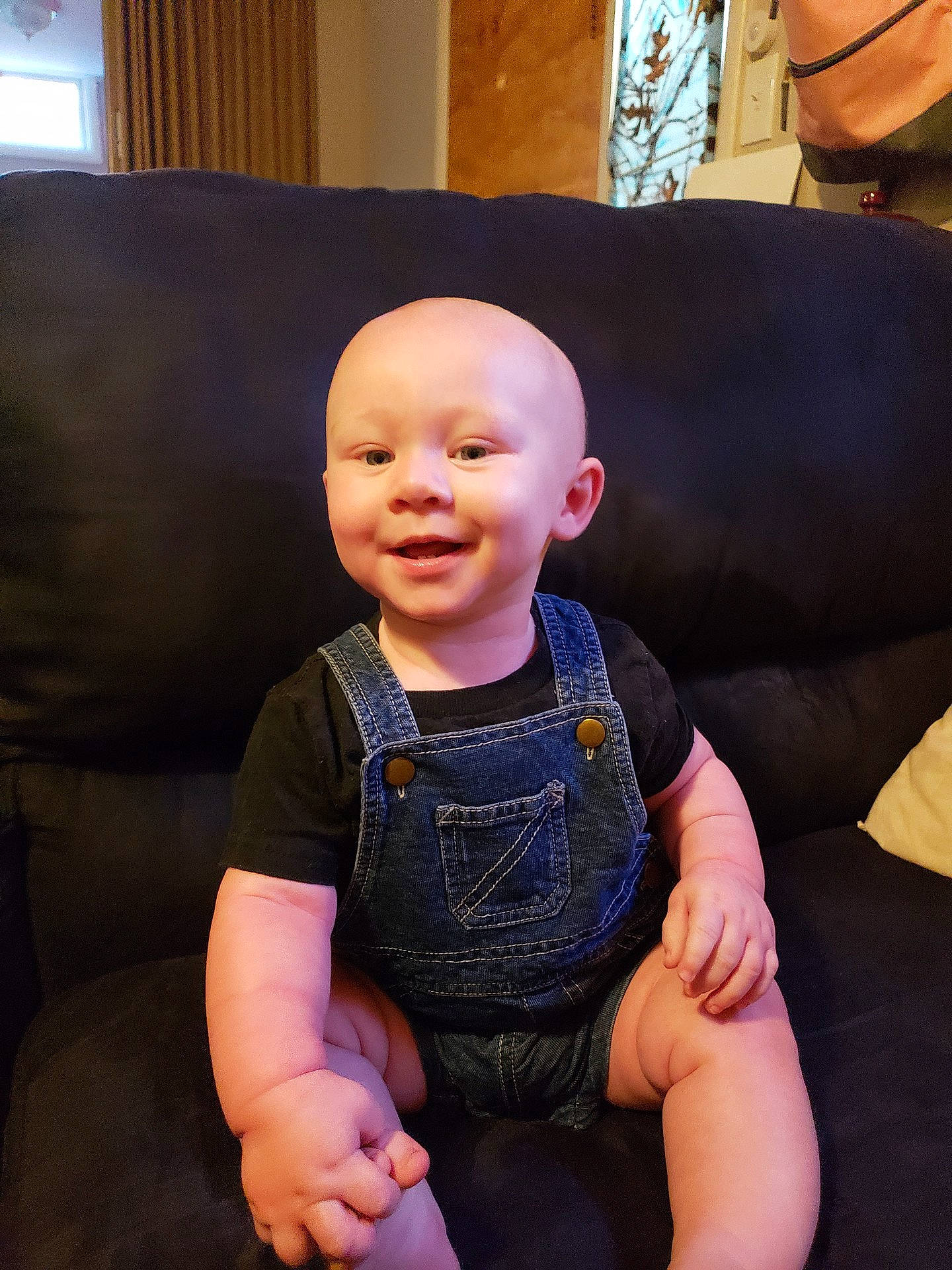 Conner is registered to the contest to win money with this photo: cheek, child, eye, fun, girl, head, infant, joy, organ, person, product, sitting, skin, smile, toddler