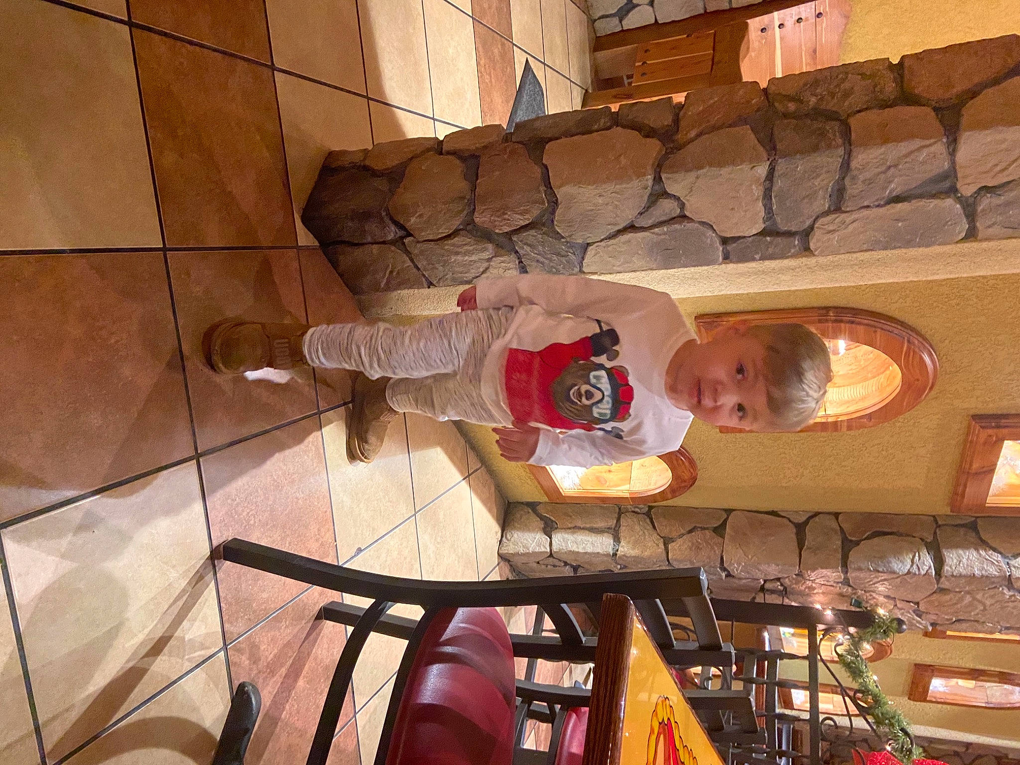 Greyson is registered to the contest to win money with this photo: architecture, clothing, eye, floor, flooring, fun, human, human_body, interior_design, lighting, people, person, product, room, shoe, social_group, town, trousers, vertebrate, wood