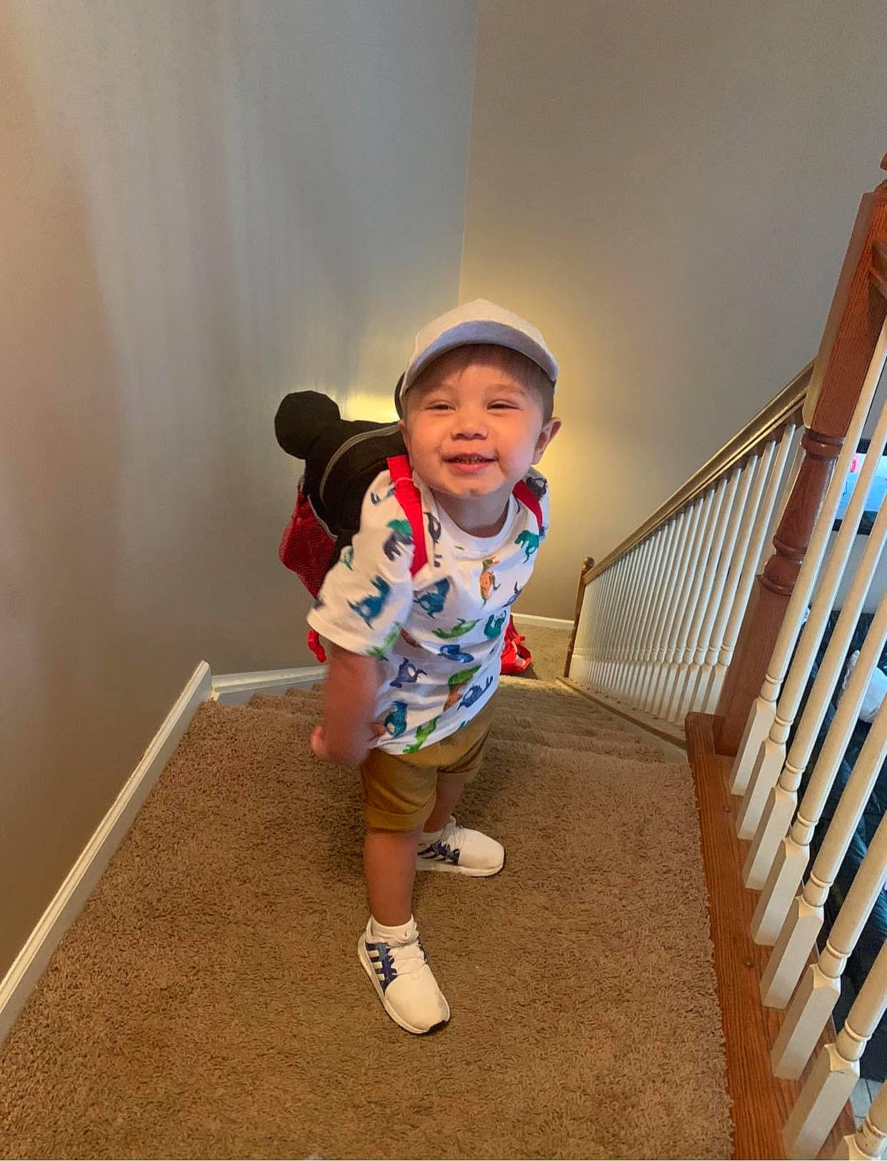 Greyson is registered to the contest to win money with this photo: baby_toddler_clothing, baseball_cap, cap, child, electric_blue, floor, flooring, fun, happy, hardwood, headwear, human_leg, joy, knee, leg, leisure, person, shorts, sleeve, sneakers