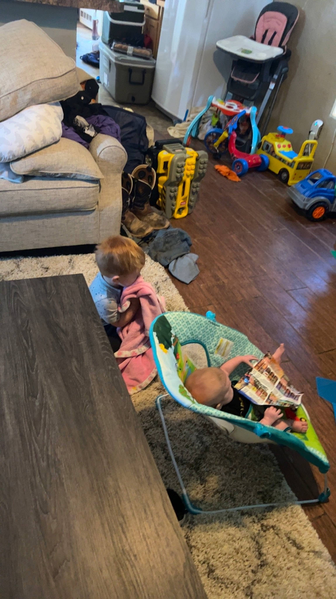 Sawyer joined the competition — help win amazing prizes! automotive_design, child, comfort, couch, floor, flooring, fun, hardwood, leisure, living_room, machine, motor_vehicle, person, recreation, room, sitting, t_shirt, tire, toddler, wheel