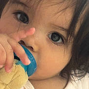 Melissa joined the competition — help win amazing prizes! child, baby, face, eyes, hand, pacifier, toy, plush, closeup, infant, cute, soft_lighting, portrait, expression, young_child, hair, skin, clothing, indoors, comfort