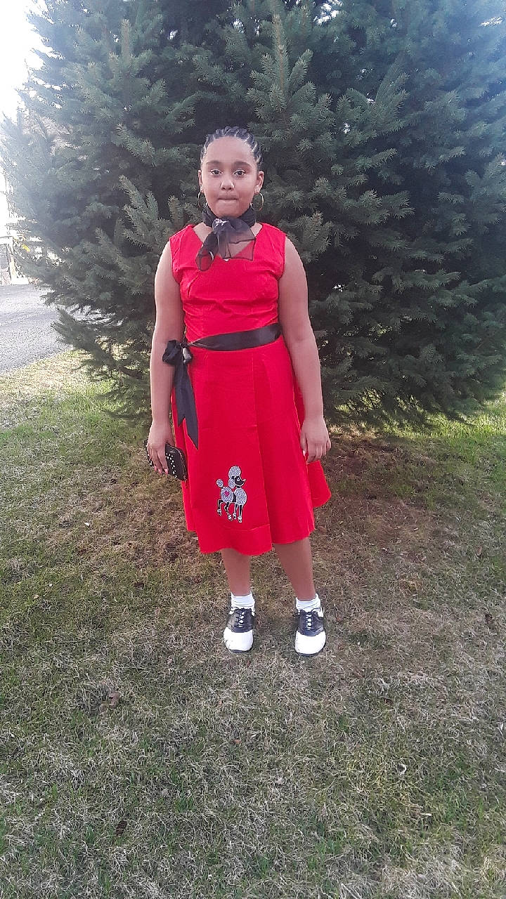 Nancy is registered to the contest to win money with this photo: clothing, dress, person, red, shoe, standing