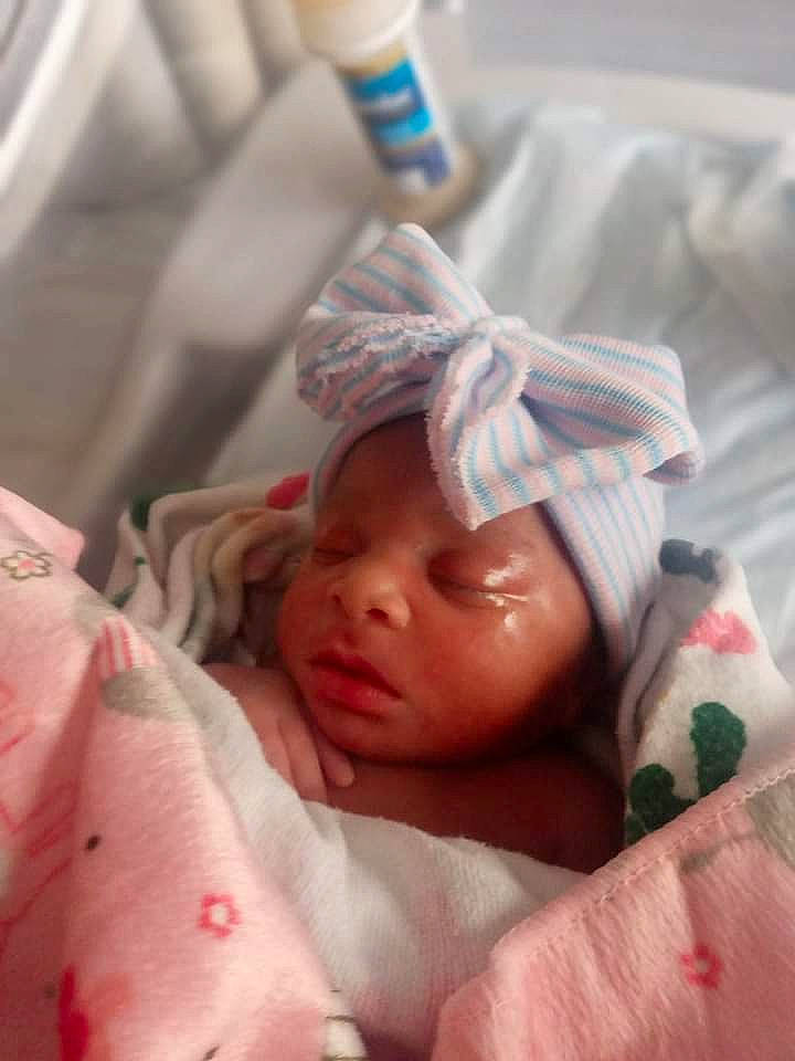 Mariyah is registered to the contest to win money with this photo: baby, baby_products, baby_safety, baby_sleeping, baby_toddler_clothing, bedding, bedtime, cheek, child, comfort, eyelash, finger, headwear, linens, nail, person, room, skin, textile, thumb