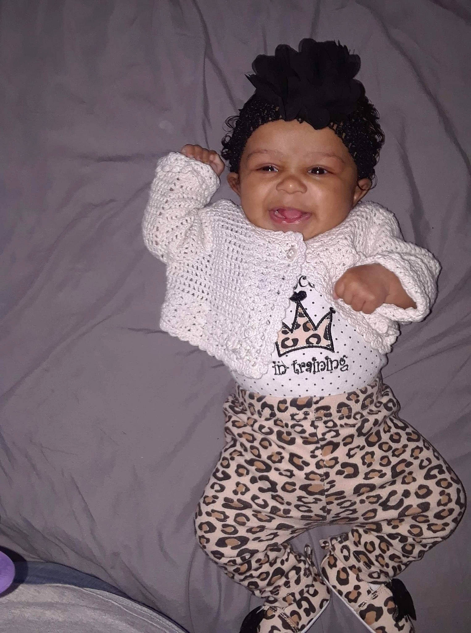 Ailani is registered to the contest to win money with this photo: child, crochet, design, girl, hair_accessory, headgear, headpiece, infant, knitting, material, outerwear, pattern, person, product, smile, textile, toddler