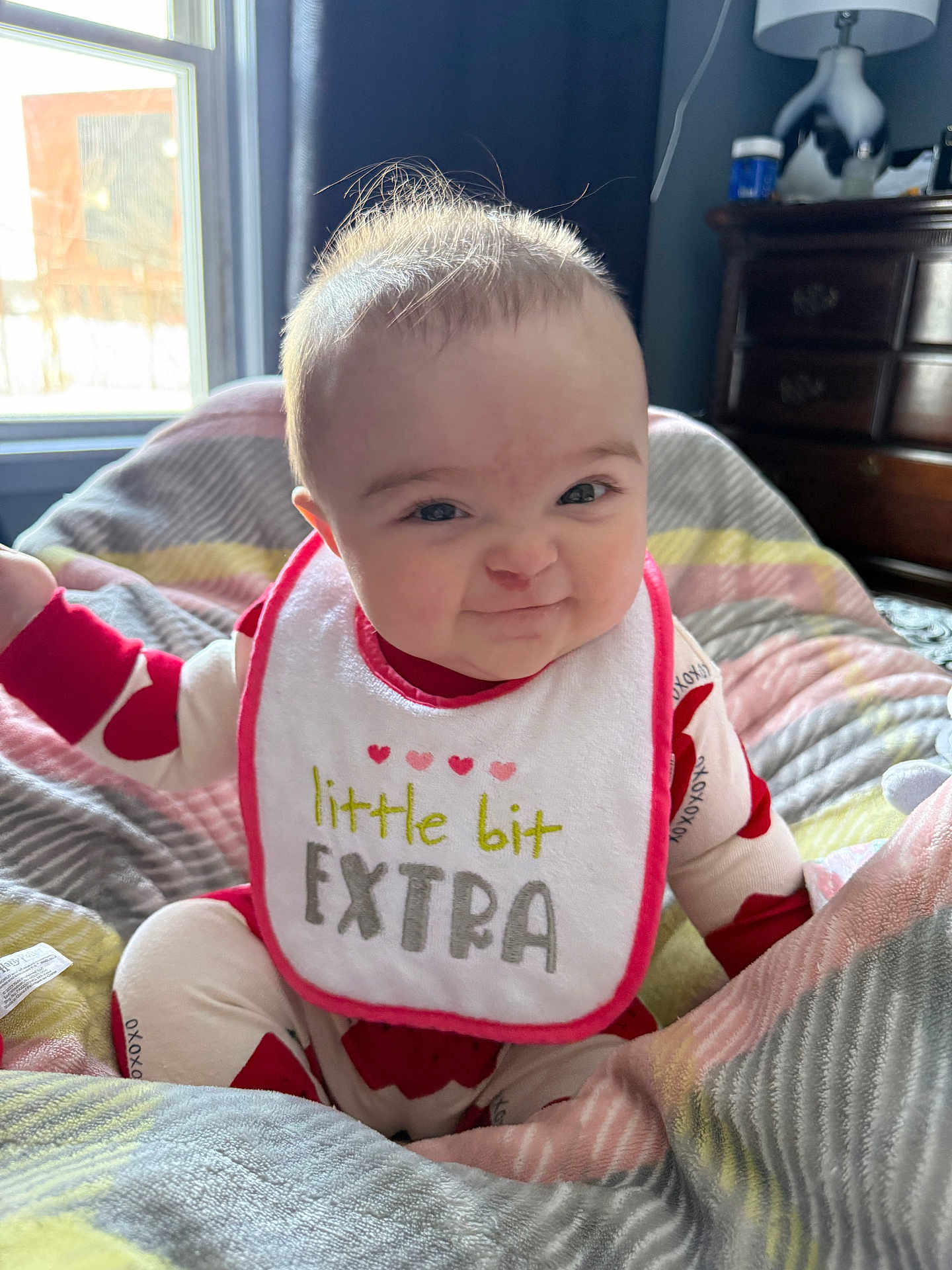 Octavia joined the competition — help win amazing prizes! baby, infant, bib, grin, smile, blanket, window, lamp, dresser, onesie, indoor, cheeks, hair, eyes, portrait, bedding, cozy, sunlight, patterned, room