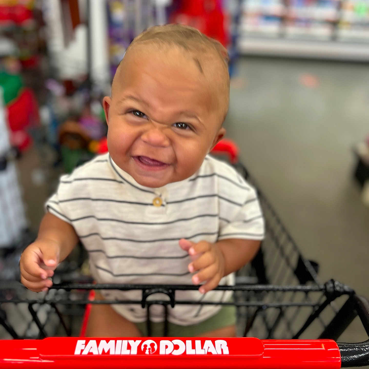 Tavis is registered to the contest to win money with this photo: baby, bicycle, bodypart, boy, child, face, finger, hand, happy, head, indoors, male, person, photography, portrait, shop, shopping, shoppingcart, transportation, vehicle