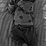 Gabin a rejoint le concours — aidez-le/la à gagner de superbes lots ! baby, infant, striped_clothing, pajamas, blanket, bed, sleepwear, lying_down, child, small_object, monochrome, black_and_white, cute, young, person, soft_texture, peaceful, indoors, portrait, cozy