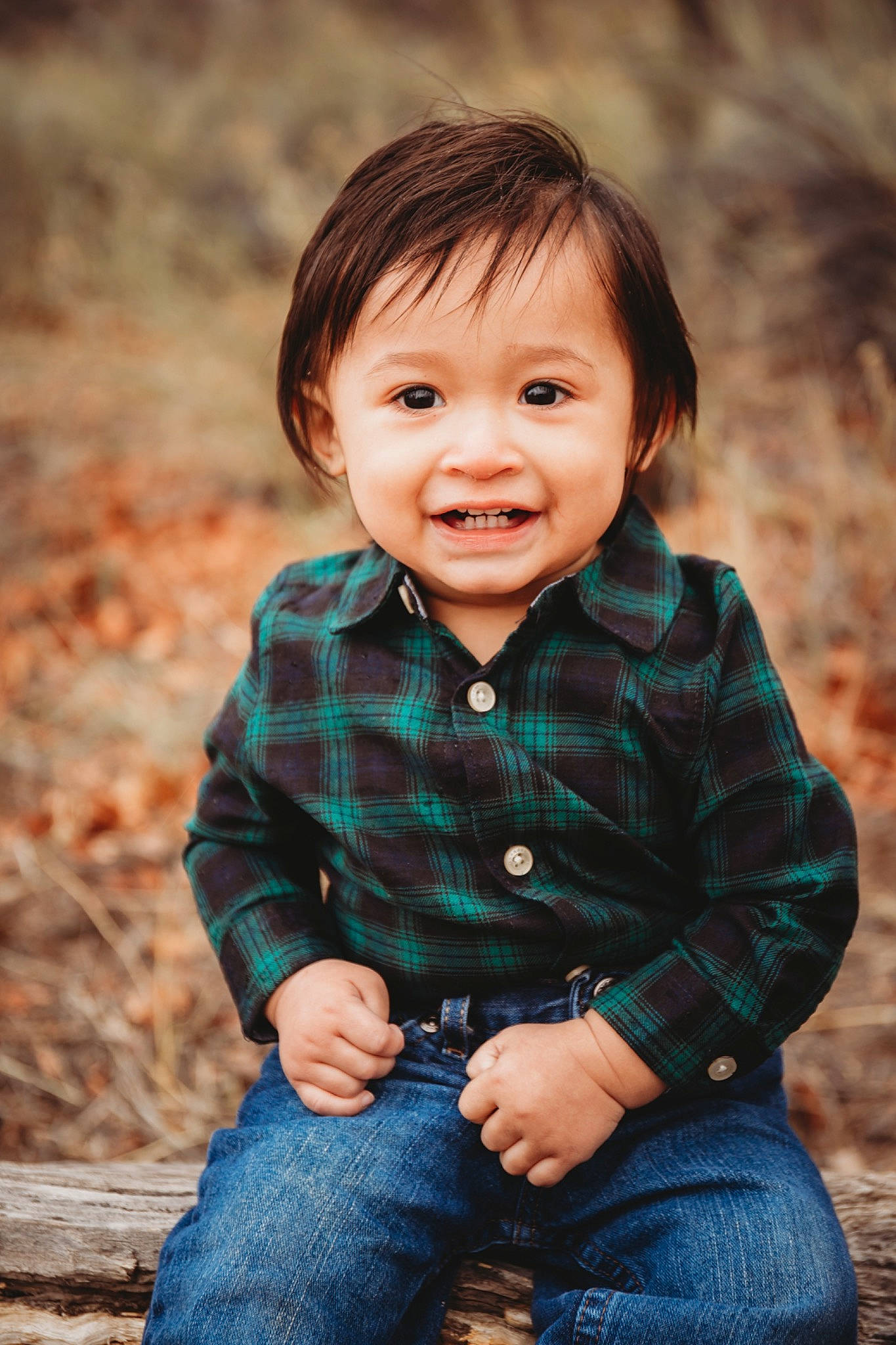 Diego is registered to the contest to win money with this photo: baby_toddler_clothing, cheek, clothing, eye, face, flash_photography, grass, hair, happy, iris, jeans, joy, people_in_nature, person, plant, skin, sleeve, smile, standing, tartan