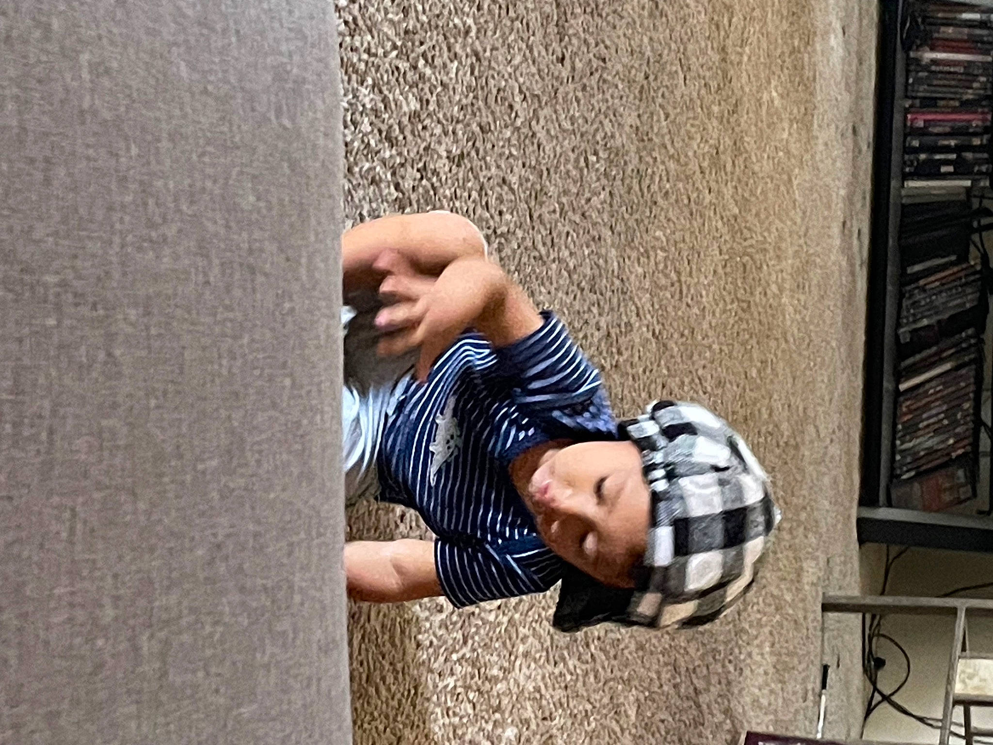 Diego joined the competition — help win amazing prizes! bag, concrete, elbow, eyewear, facade, finger, foot, headwear, helmet, human_leg, leisure, pattern, person, plaid, shadow, sitting, street, sunglasses, toddler, tree